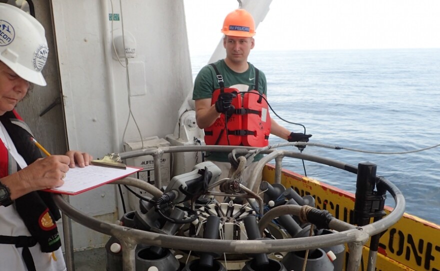 Nancy Rabalais, left, takes notes on the deck of the R/V Pelican during the summer of 2018. Rabalais has been measuring the size of the dead zone in the Gulf of Mexico for more than 30 years. 101619