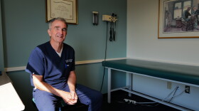 Ralph Northam sits in an exam room where he spends much of his time treating patients.