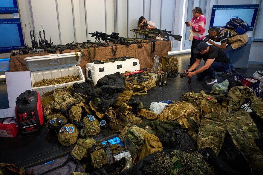 FILE - Weapons that Cuban authorities say were recovered from a speedboat in Cuban waters following a confrontation that left four people dead are displayed during a media presentation in Havana, Feb. 27, 2026.