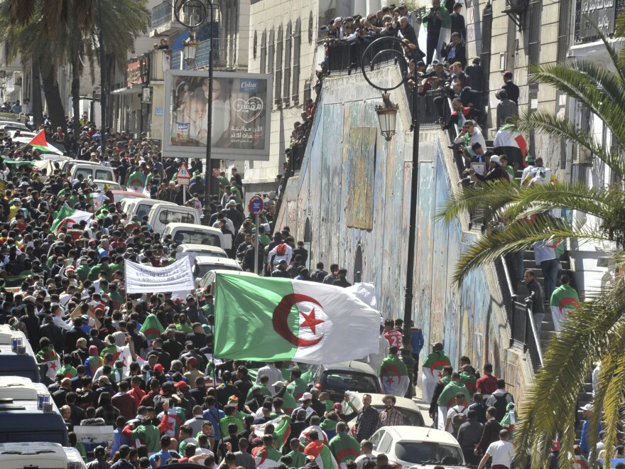 Protesters march in Algiers, Algeria, on Friday against President Abdelaziz Bouteflika.