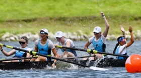 Narragansett Boat Club's U 17 Coxed Four exults after crossing the finish line first at the USRowing National Youth Championships.