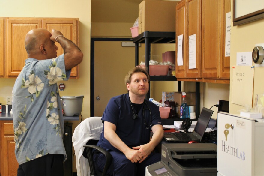 Physician Sonny Saggar, left, nurse practitioner Michael Zappulla discuss the day's plans at North City Urgent Care, one of two urgent care clinics in north St. Louis.