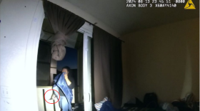 Anchorage police body camera footage shows Easter Leafa, 16, holding a knife (circled in red) as officers approach her. (Office of Special Prosecutions)