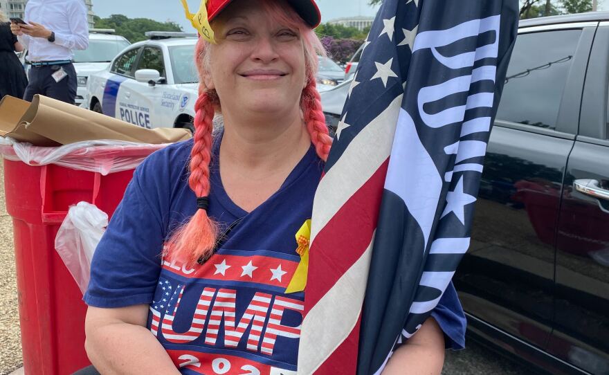 Suzzane Monk sits outside the E. Barrett Prettyman U.S. Courthouse in Washington, D.C., in support of former President Donald Trump.