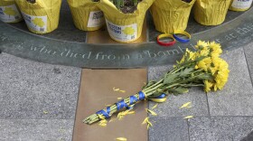 Flowers are placed at a memorial for victims of the 2013 Boston Marathon bombing. (Reba Saldanha/AP)