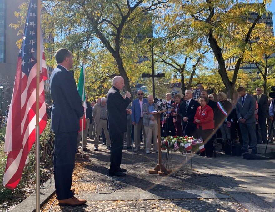 Father Joseph Clemente, Pastor of St. Marianne Cope Parish, leads the group in prayer before the wreath laying.