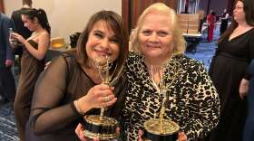 Pamela Watts and Barbara Dury hold Emmy's won for Arts/Entertainment News.