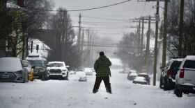 Snow fell across Louisville and Southern Indiana this weekend, ahead of frigid cold expected to keep it in place.