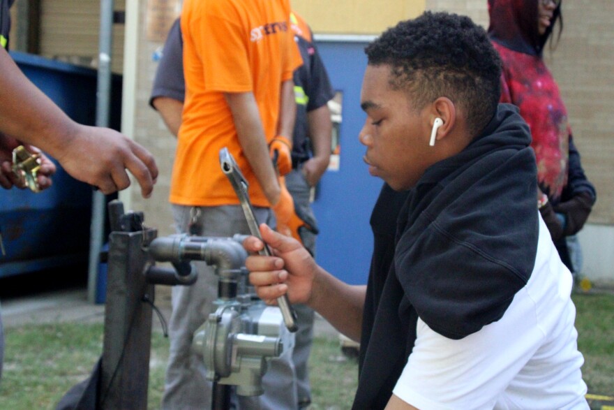 Sophomore Anthony Kyle learns how to set a utility meter as part of Kansas City Public Schools' career exploration program this summer.