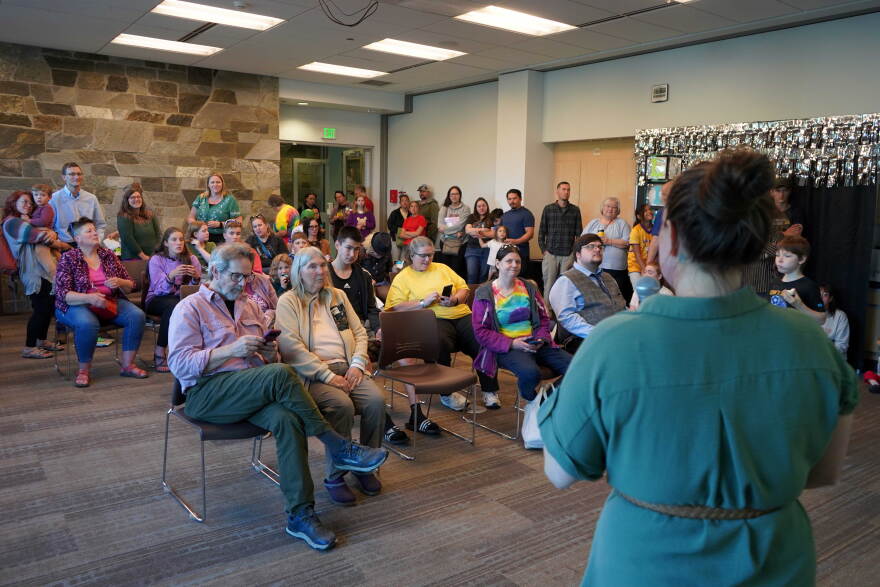 People pack the community room at the Soldotna Public Library in Soldotna, Alaska, for an unveiling of a series of limited edition library cards on Tuesday, Sept. 1, 2026. 