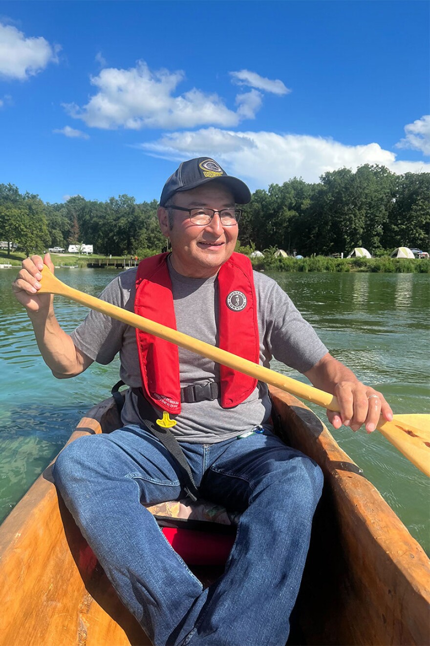 Quackenbush paddles in a dugout canoe made out of a cottonwood tree.