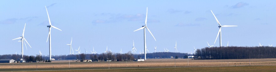 Wind turbines across a rural area.