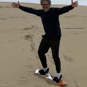 The host on his first successful sand surf run.