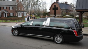 The hearse carrying Billy Graham's casket arrives at the Billy Graham Library Saturday, Feb. 24, 2018. 