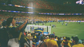 As shot on a Vivitar 35mm film camera, Curaçao fans cheer on their team at a World Cup game against Ecuador on June 20, 2026, at Arrowhead Stadium in Kansas City.