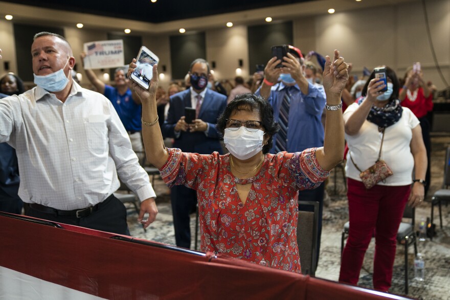 Supporters of President Donald Trump cheer as he arrives to speak during an event on "Protecting America's Seniors," Friday, Oct. 16, 2020, in Fort Myers, Fla. (AP Photo/Evan Vucci)