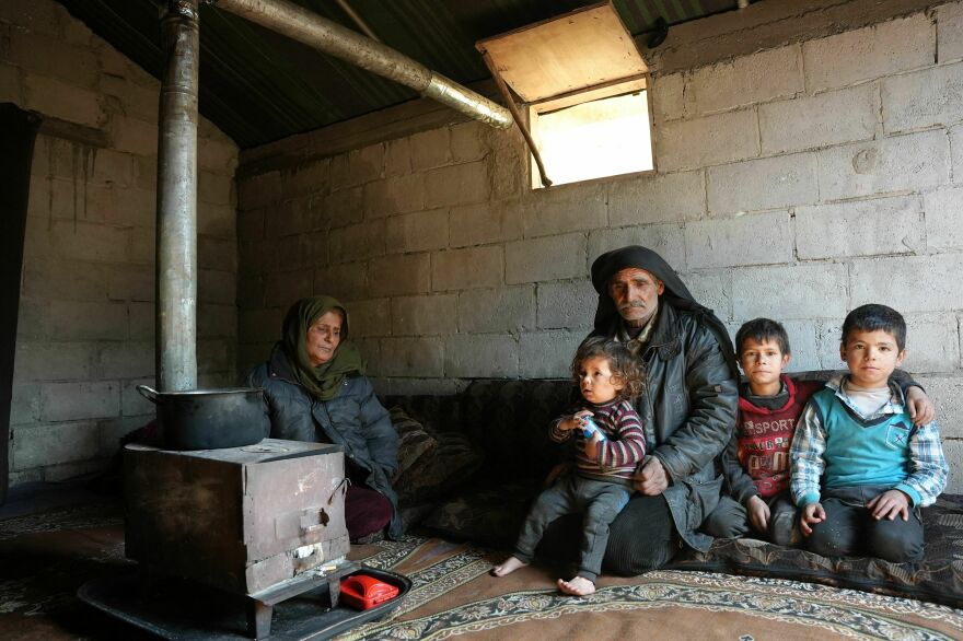 A Syrian family who lost their home during the deadly earthquake rest in a make-shift shelter at a camp for internally displaced people, in the Afrin region of Syria's rebel-held northern Aleppo province.