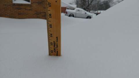 A ruler shows nearly a foot of snow at a home in central Kettering as of Sunday afternoon.