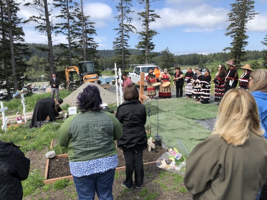 People at a burial ceremony