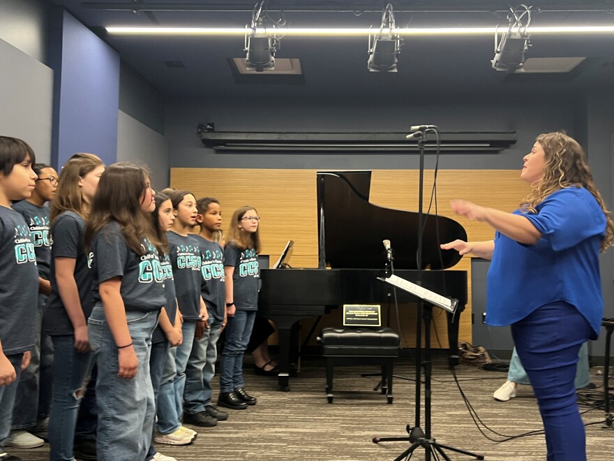 Alyssa Avenatti conducts the Children's Chorus live on KPAC 88.3 FM.