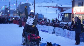 2026 Iditarod Trail Sled Dog Race champion Jessie Holmes arrives at the 1,000-mile race's finish line in Nome the evening of Tuesday, March 17, 2026.