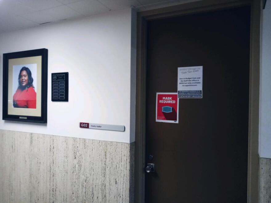 Jessica Thomas' office in the Peoria County Courthouse. A sign on the door says the office is open by appointment only due to budget cuts.