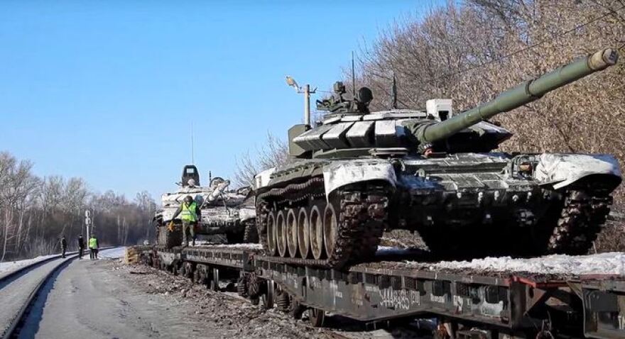 Russian army tanks on a snowy road.