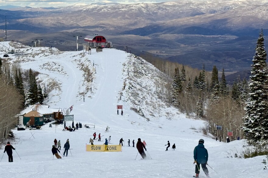 Skiers and riders travel down upper Homerun from Bonanza Express after it opened Dec. 20, 2025.
