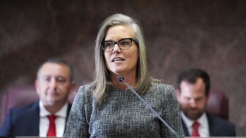 Democratic Arizona Gov. Katie Hobbs, center, is flanked by Arizona House Speaker Ben Toma, R-Glendale, left, and Arizona Senate President Warren Petersen, R-Gilbert, right, at Hobbs' state of the state address at the Arizona Capitol in Phoenix on Jan. 9, 2023. On Friday, Jan. 13, 2023, Hobbs' office released its budget proposal, including her plan to seek a repeal of a massive expansion of Arizona's school voucher program.