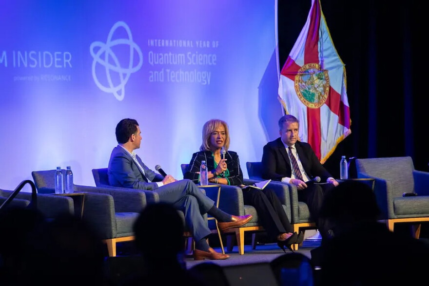 Matt Cimaglia, left, founder of Quantum Coast Capital, moderates a discussion with Palm Beach State College President Ava Parker and Florida Commerce Secretary Alex Kelly at last year’s Quantum Beach conference in West Palm Beach.