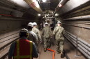 Rear Adm. John Korka, Commander, Naval Facilities Engineering Systems Command (NAVFAC), and Chief of Civil Engineers, leads Navy and civilian water quality recovery experts through the tunnels of the Red Hill Bulk Fuel Storage Facility, near Pearl Harbor, Hawaii, on Dec. 23, 2021. 