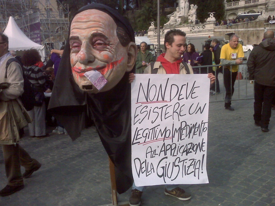 In Rome, thousands took to the streets to protest a culture of corruption that seemingly has become pervasive. This poster derides a bill being pushed by Prime Minister Silvio Berlusconi that would shield him from prosecution while in office.