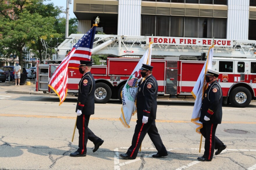 Peoria Fire Department Honor Guard in the middle of posting the colors.