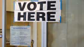 Signs for voting posted outside the Mendenhall Valley Library on Election Day on Tuesday, Oct. 7, 2025.