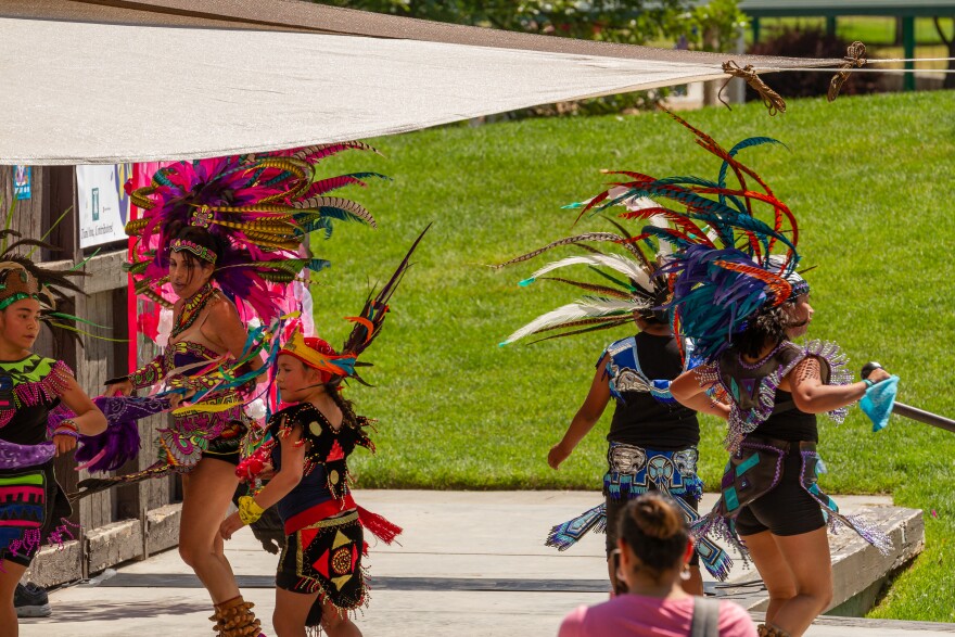 Danza Azteca Tonatiuh dancing on a stage at KYMfest.
