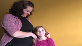 From left to right, Holly Whistler with her daughter, 8 year-old MacKenzie Whistler. MacKenzie is switching schools in the middle of the third grade because the charter school she had been attending closed in December.