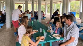 Families enjoying BBQ Dinner, catered by Wild Thyme