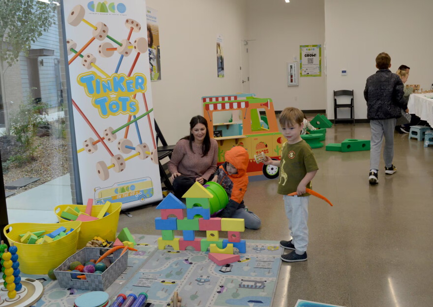 Erica Segal, director of the Central Oregon Children’s Museum, watches as her son Lincoln Segal, 6, tries to knock down a foam tower at the museum’s pop-up event on Oct. 11, 2026 in Bend.