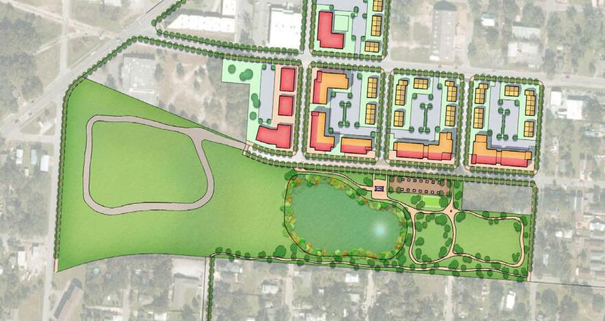 Conceptual site plan showing a proposed park with walking paths, open lawn, trees and a central pond, adjacent to new mixed-use buildings arranged in blocks along a street grid in Pensacola’s Westside CRA area.