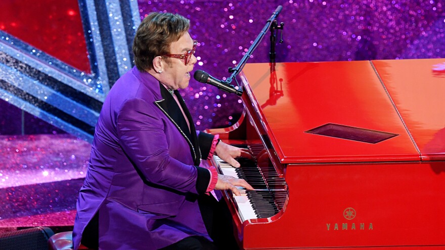 Elton John performs at the Academy Awards on Feb. 9 in Los Angeles. He had to end a show in New Zealand early. He told his fans: "I gave it all I had."