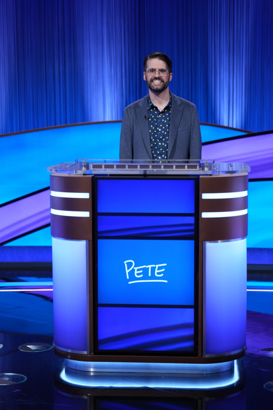 Pete Johnston behind his "Jeopardy!" podium on set