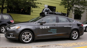 A self driving Uber car drives in Pittsburgh on Wednesday, Sept. 14, 2016. While the vehicles are loaded with features that allow them to navigate on their own, an Uber engineer sits in the driver's seat and can seize control if things go awry. (Gene J. Puskar/AP)