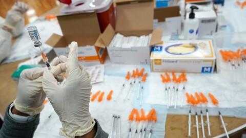 A Northwell Health registered nurse fills a syringe with a COVID-19 vaccine at a pop up vaccination site the Albanian Islamic Cultural Center, April 8, 2021, in the Staten Island borough of New York. (AP Photo/Mary Altaffer, file)