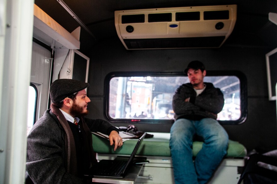 Inside the exam room on the "bupe bus," as the mobile medical clinic is called, Dr. Ben Cocchiaro and Louis Morano talk over Morano's options. Morano says he's committed to his recovery this time and wants the support of buprenorphine to help him quit heroin.