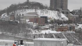 The Cincinnati neighborhood of Mount Adams is shown blanketed in snow Saturday, Jan. 25, 2014, after fresh snow fell across Ohio overnight Saturday and was continuing in the morning, creating hazardous driving conditions that caused several crashes.