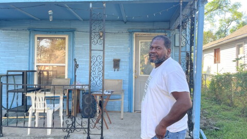 James Mays stands in front of his home in Wyandotte County. He's fighting to keep his property out of the coming tax sale.