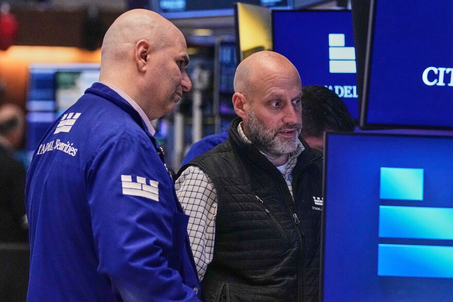 Specialists Philip Finale, left, and Meric Greenbaum work on the floor of the New York Stock Exchange, Friday, May 29, 2026. (AP Photo/Richard Drew)