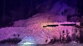 An Alaska Railroad freight train buried in snow after running into an avalanche on the tracks near Girdwood on Jan. 17, 2023.