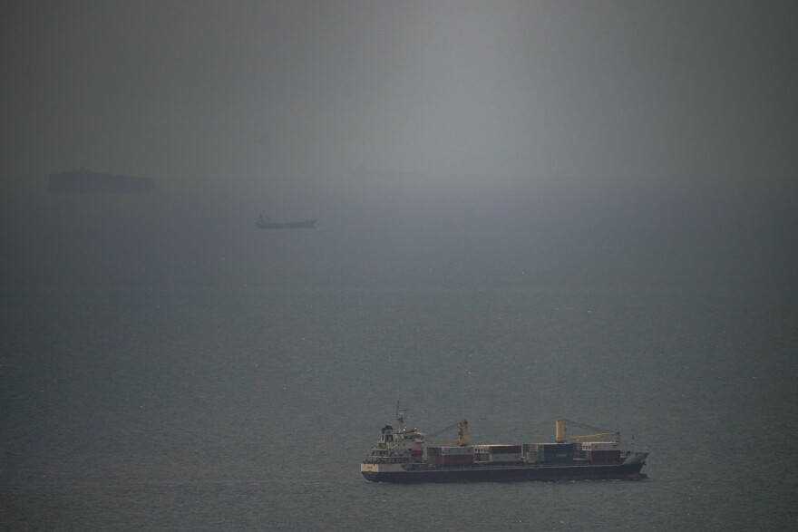 A cargo ship sails in the Persian Gulf toward the Strait of Hormuz, Wednesday, April 22, 2026. (AP Photo)