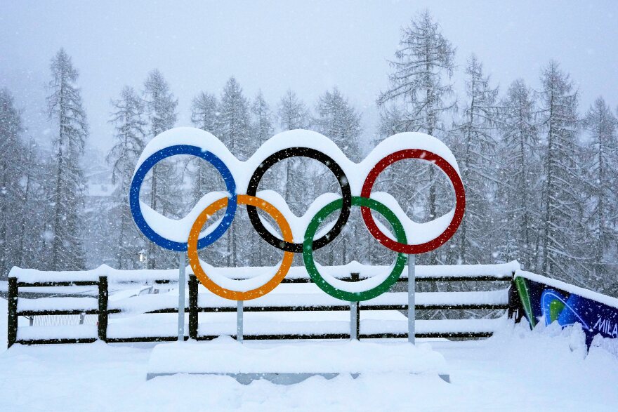 Olympic rings are covered by snow at the sliding center during the 2026 Winter Olympics, in Cortina d'Ampezzo, Italy, Thursday, Feb. 19, 2026. (AP Photo/Alessandra Tarantino)